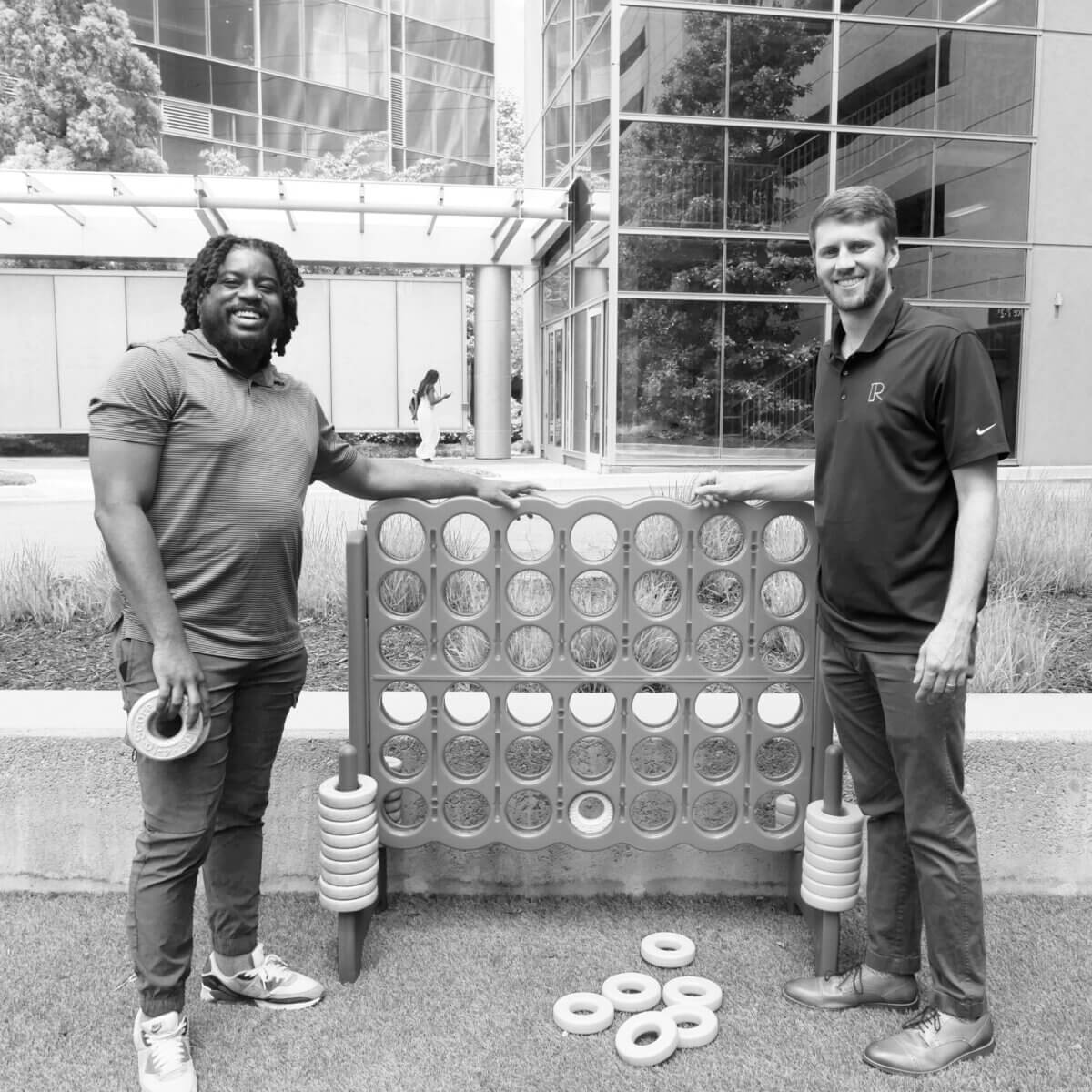 Two people beside an outdoor game